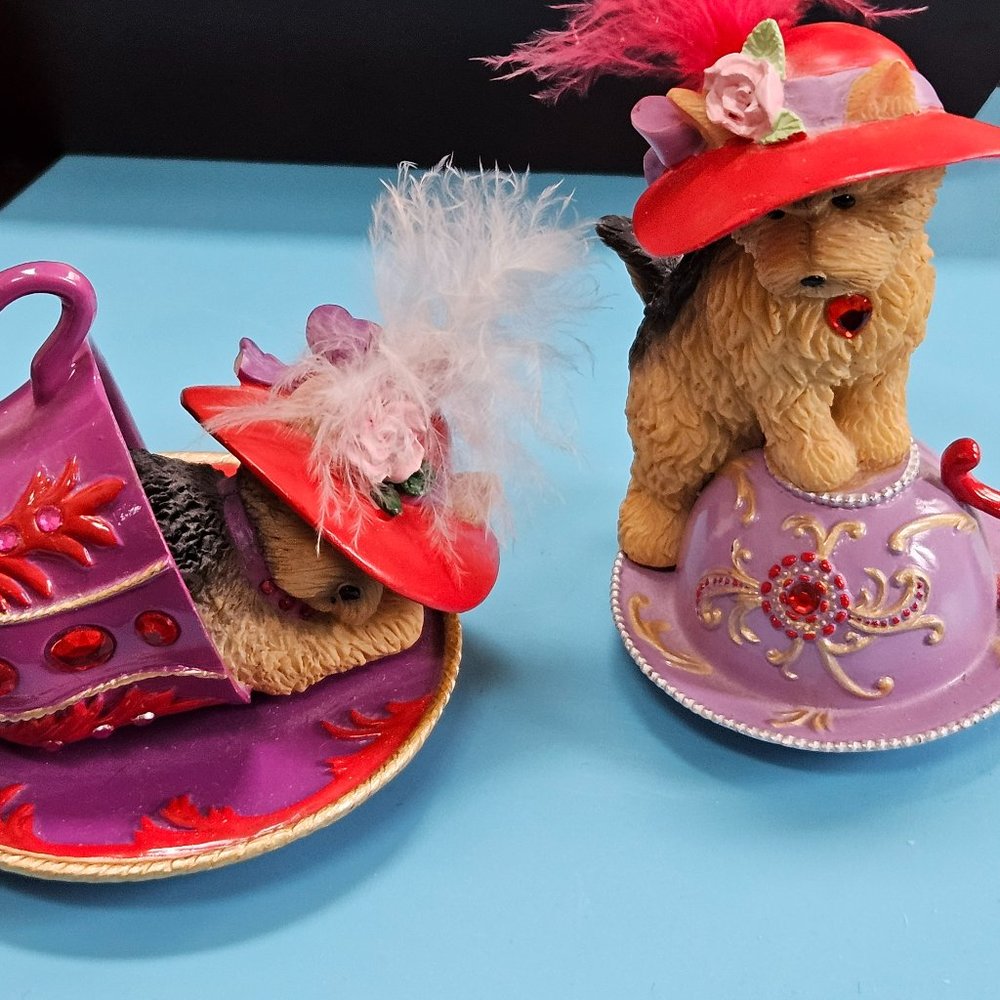 Set of two adorable flamboyant tea collection both are labeled on bottom.
